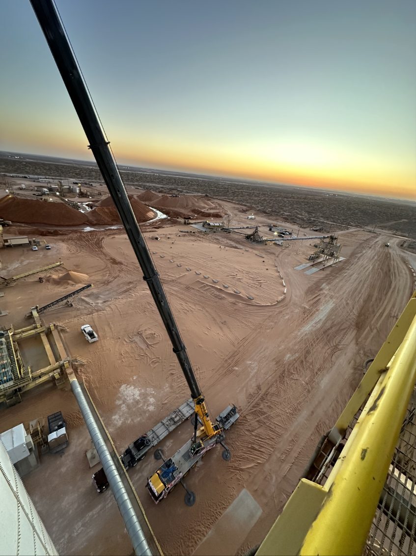 Crane at a sand plant at sunset